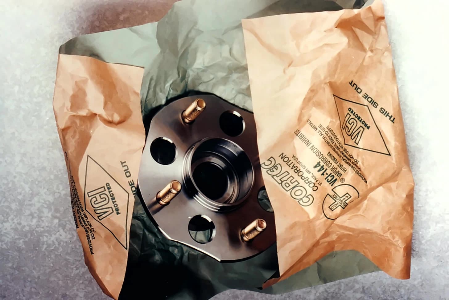 Machined flange wrapped in Cortec VpCI paper